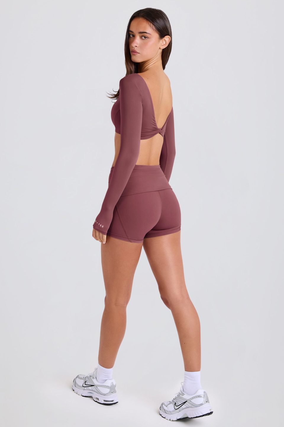 Four-Way Stretch Foldover Mid-Rise Mini Shorts in Acai
